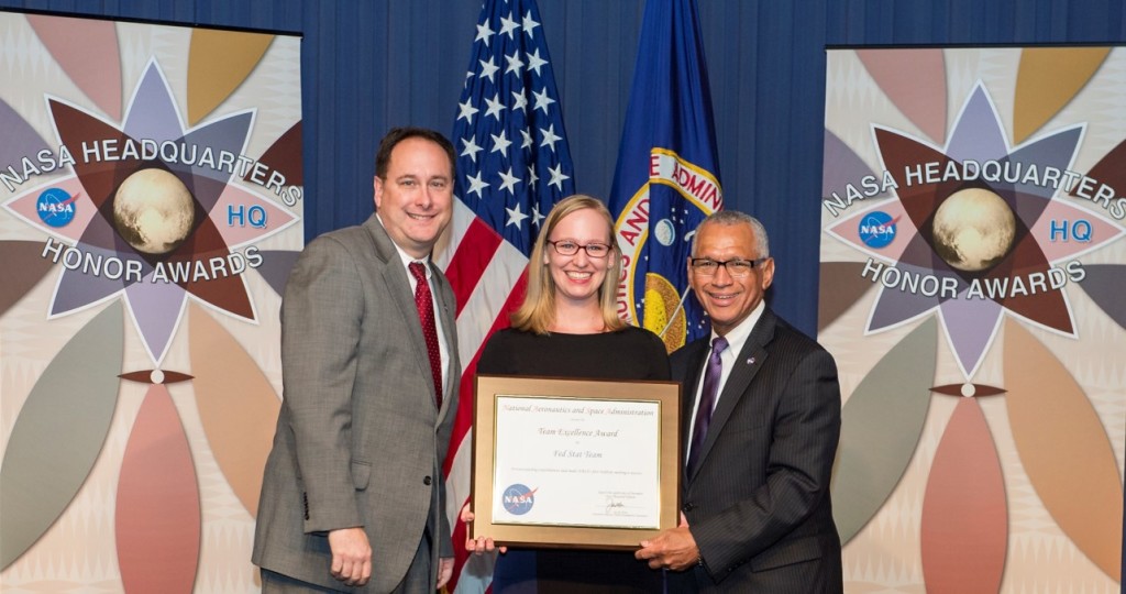 Emma Lehnhardt with NASA Associate Administrator Robert Lightfoot [L] and NASA Administrator Charlie Bolden [R]. accepting an award at NASA HQ Honors Awards ceremony on behalf of her team, who organized NASA's first FedStat meeting.  FedStat is a new initiative to benchmark across all federal agencies and focus on mission performance.