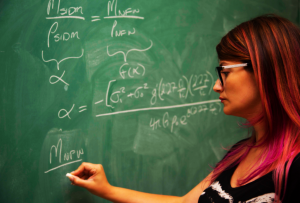 Sophia Nasr working out equations for her dark matter research