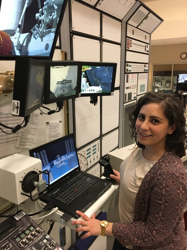 Kristen Facciol simulating Canadarm operations on-ground