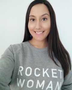 Rocket Women Founder Vinita Marwaha Madill wears the 'Rocket Woman' jumper. Proceeds from Rocket Women apparel support a scholarship for a young woman to attend the International Space University (ISU).