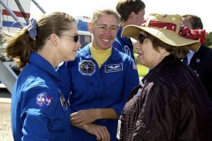 STS-112 Pilot Pamela Melroy (left) and Mission Specialist Sandra Magnus (center) talk to Acting Deputy Director JoAnn Morgan (right) after the crew's return to KSC. Credit: NASA
